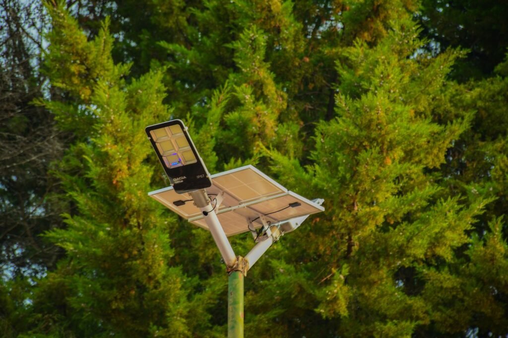 Solar street light illuminating a rural African road at dusk