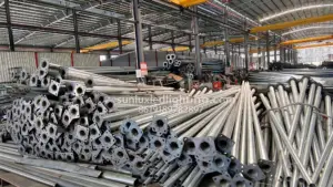 Steel lighting poles stacked in the Sunlux LED Lighting factory